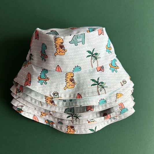 Reversible children's bucket hat with UV protection - hand-painted design - dinosaurs